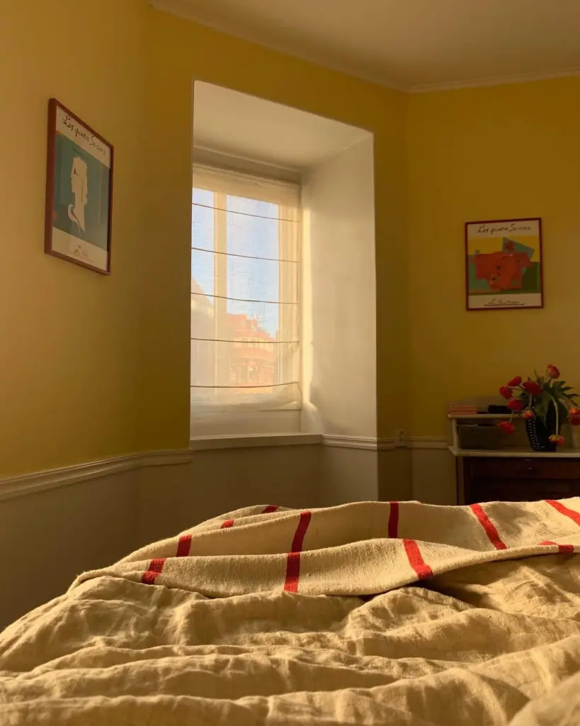 Bedroom painted in yellow.